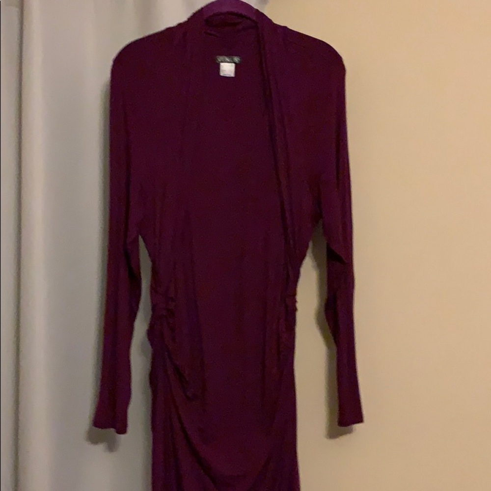 Burgundy dress, long sleeves, accents the waist
